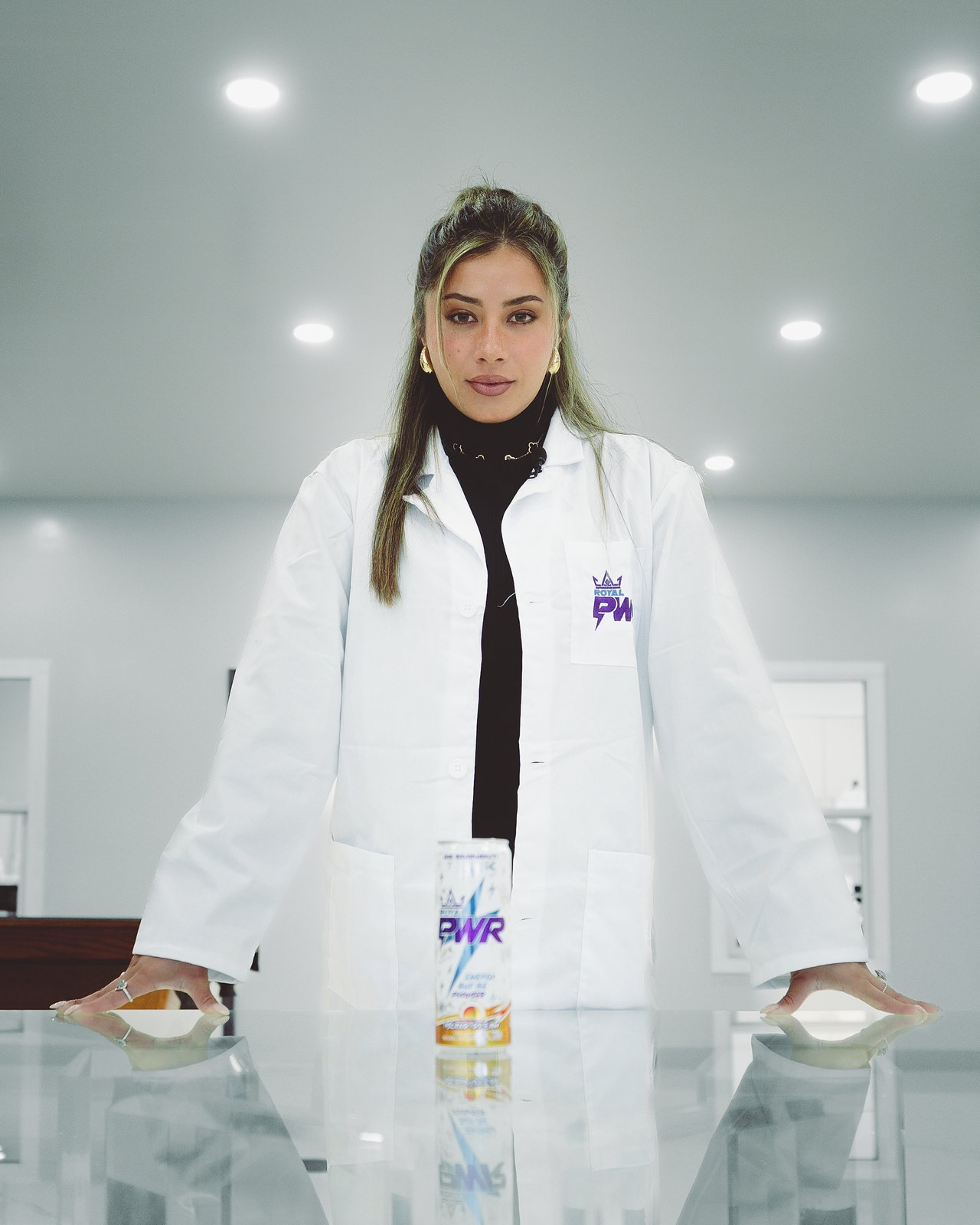 Royal PWR in the lab: a can on the counter and the logo on a lab coat